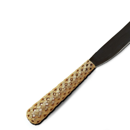 The L'Objet Braided Cake & Bread Knife features a metallic blade and a 24k gold-plated, intricately woven handle—an elegant choice for your serveware collection or as part of a luxury gift box. Shown on a white background.