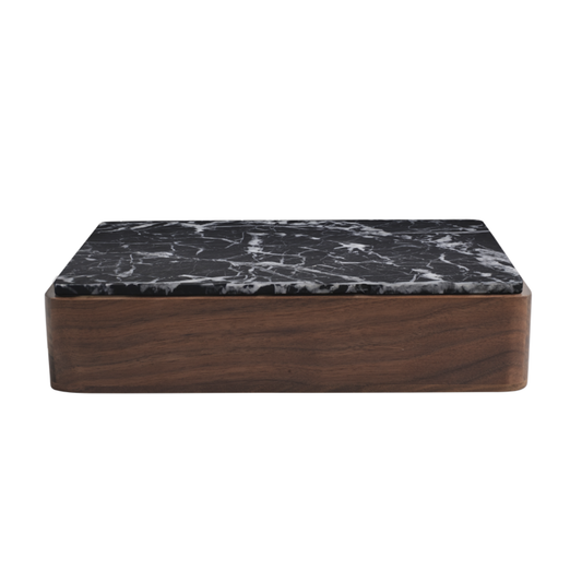 The Terreno Box by Greg Natale features a dark wooden base and black marble-patterned lid, displayed against a white background.