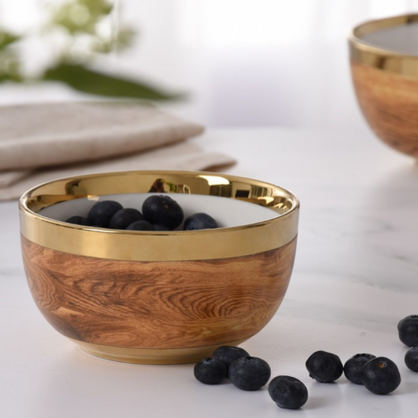 Madera Gold Snack Bowl with gold embellished rim with blueberries on top.