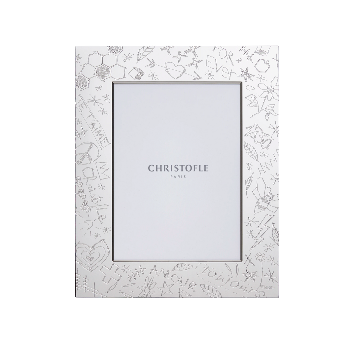 This 5x7 frame is from Christofle. Silver-plated, this frame features French graffiti.