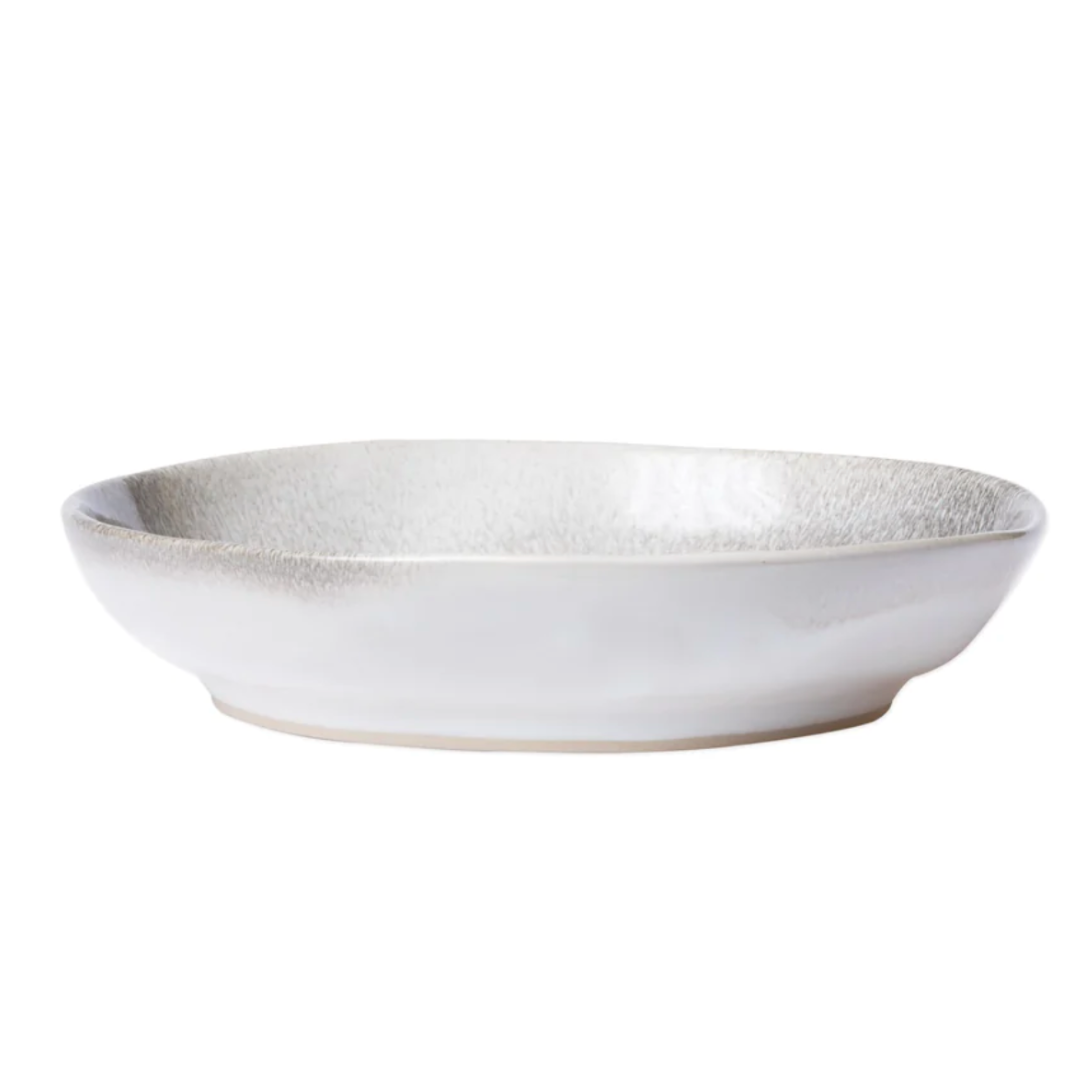 The aurora pasta bowl features an ash-like design, and is made of stoneware.