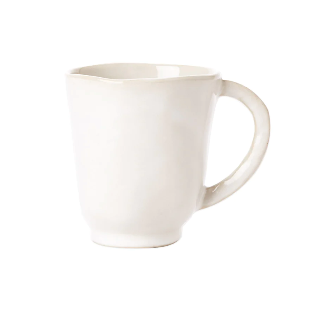 The forma cloud mug features an organic white stoneware design.