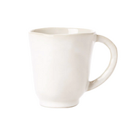 The forma cloud mug features an organic white stoneware design.