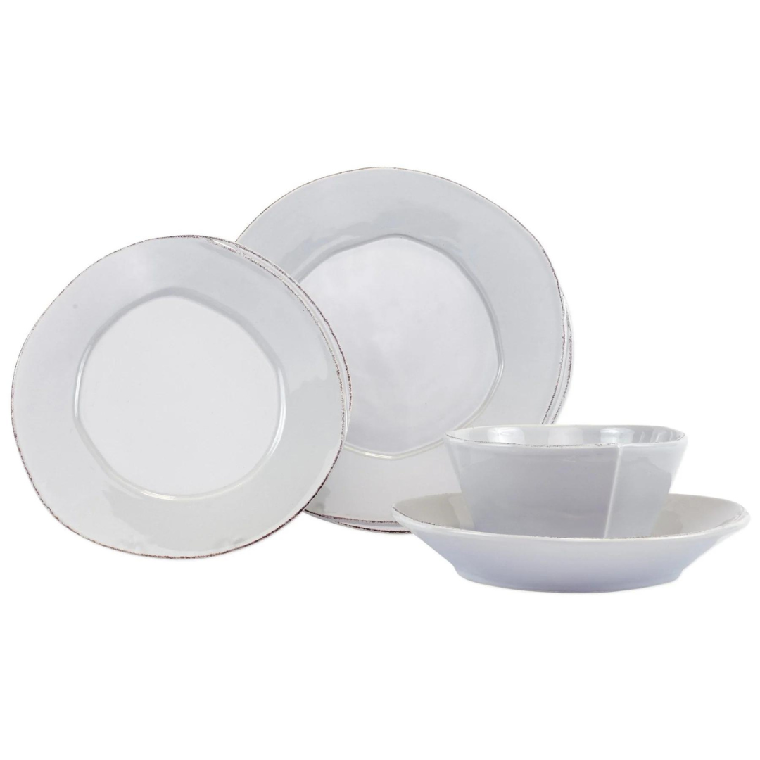 Light grey Lastra dinnerware set. Includes salad and dinner plate, cereal bowl, pasta bowl, and mug. All made of stoneware.
