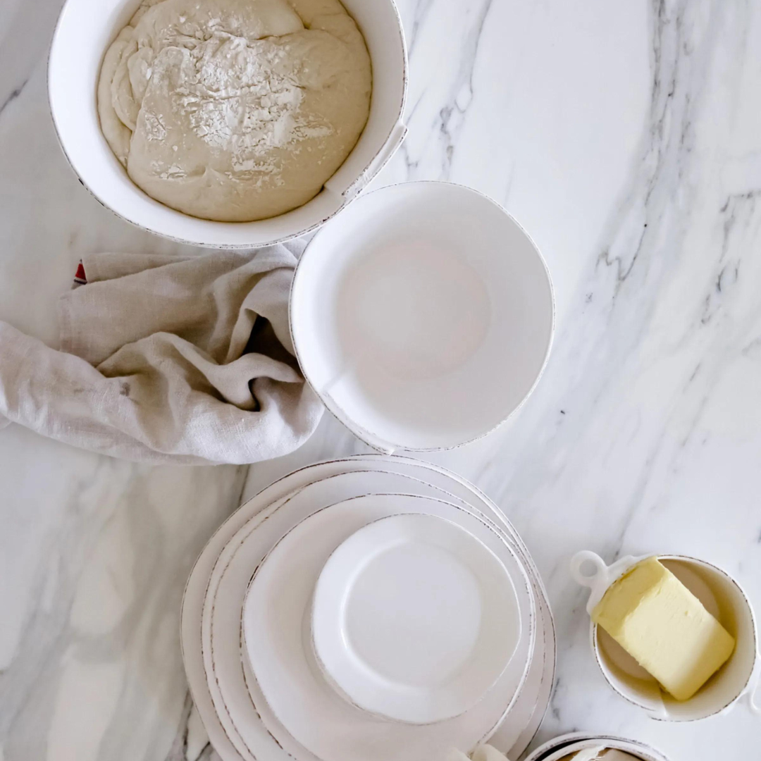 Made of premium white durable stoneware, the stacking bowls are timeless.