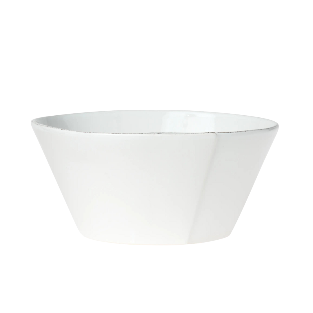 The medium stacking bowl is made of durable and timeless stoneware. This bowl is white.