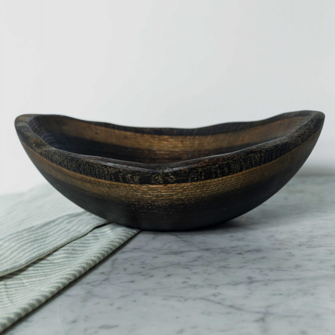 Oval wood bowl in black ebonized.