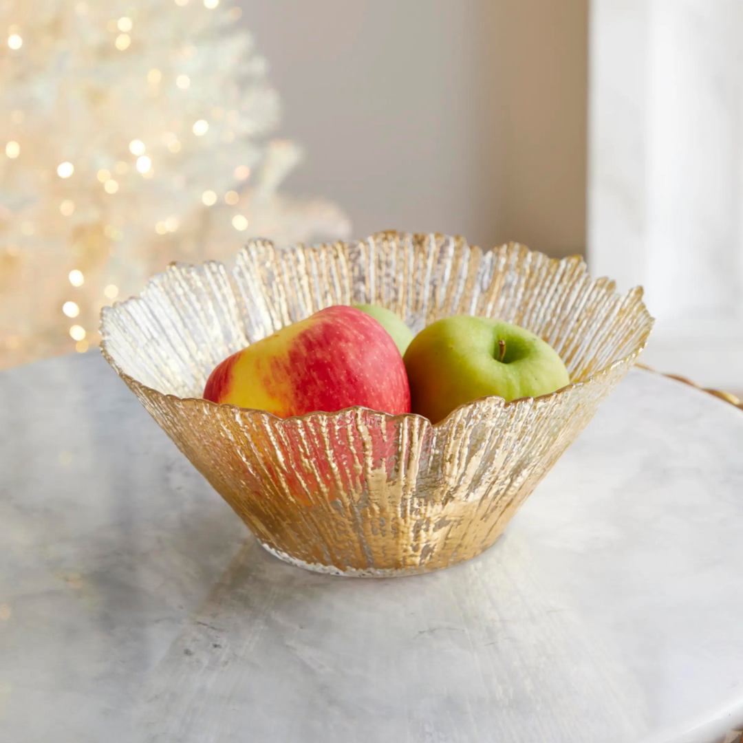 This deep glass bowl is embellished with golden trims.