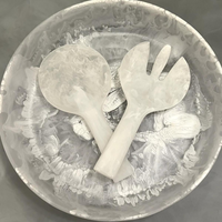 White swirl resin jumbo servers on resin plate.
