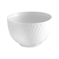 A white ceramic bowl from Meissen’s Waves Relief N°41 Dinnerware collection, featuring a textured, scale-like exterior pattern, set against a plain light background.