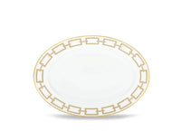 A Catene Cachemire Beige Dinnerware plate by Ginori 1735 features a geometric gold border around the rim, shown on a plain white background.