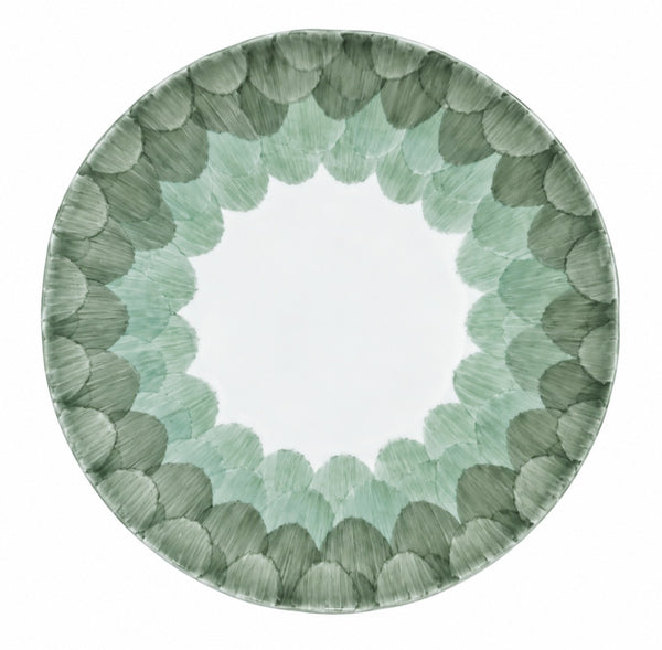 Marie Daâge Cercle d’Ecailles dessert plate, hand-painted with a central white circle surrounded by a scalloped, overlapping scale pattern in shades of sage and forest green.