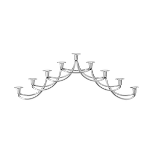 The Georg Jensen Harmony Menorah is a modern, silver Hanukkah menorah with three tiers and nine candle slots. Featuring smooth, arched lines and a symmetrical form, it is shown against a plain white background.