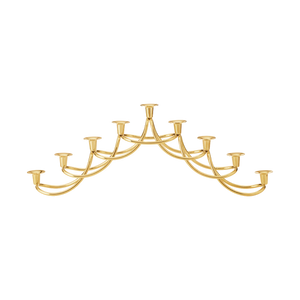 The Harmony Menorah by Georg Jensen showcases ten arching candle holders in elegant 18kt gold plate, making it a stunning display piece for Hanukkah candles against a plain white background.