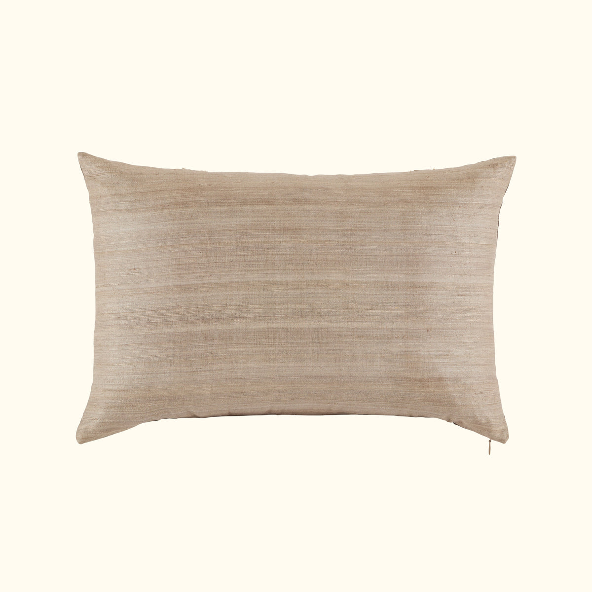 The Kasai Pillow 16 x 24 by Threads Soft Goods is a rectangular beige throw pillow with subtle horizontal stripes, inspired by Kuba cloth designs, shown against a plain off-white background.