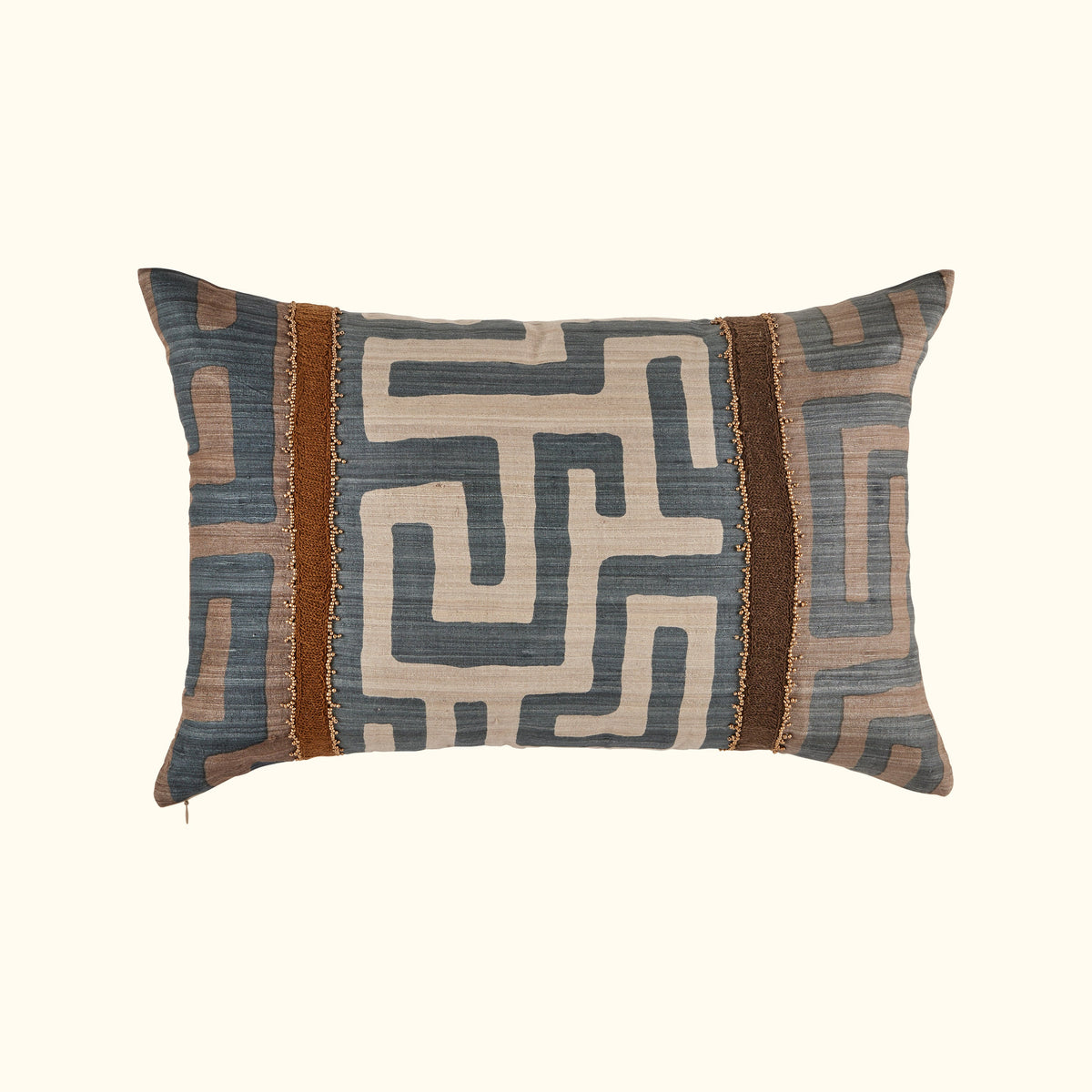 The Kasai Pillow 16 x 24 from Threads Soft Goods features a geometric maze-inspired design in blue, beige, and brown with two vertical brown textured stripes and decorative trim, handcrafted and inspired by Kuba cloth pillows.