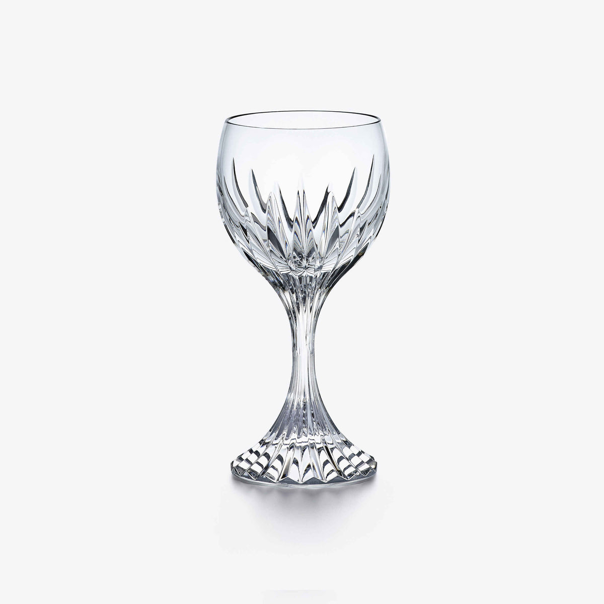 A clear crystal Massena Glass Large by Baccarat, featuring an ornate faceted design on both the bowl and stem, stands against a plain white background—an exquisite example of luxury barware at its finest.