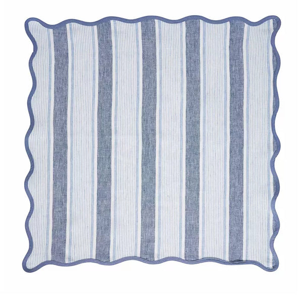 The Juliska Cabana Stripe Napkin Set of 4 - Ocean features square napkins with alternating vertical light blue and white stripes and a wavy scalloped trim along the blue border.