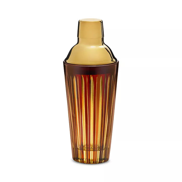 Amber Prism Cocktail Shaker by L’Objet, featuring vertical ridges and a gold-toned lid, beautifully displayed against a plain white background—an elegant example of hand-crafted glassware from the Prism collection.