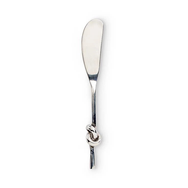 The Inspired Generations Knotty Spreader Knife, crafted from stainless steel and featuring a simple design with a decorative knot in the handle, is elegantly photographed on a white background—making it perfect for serving as both a butter knife and spreader.