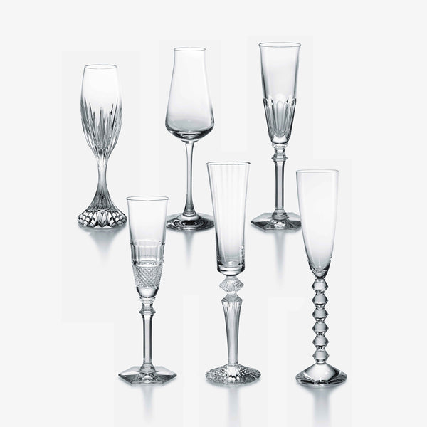 Six elegant, empty Baccarat Best Seller Bubble Box Flutes are arranged in two rows on a plain white background, showcasing their unique stem and bowl designs—a perfect gift set for any celebration.