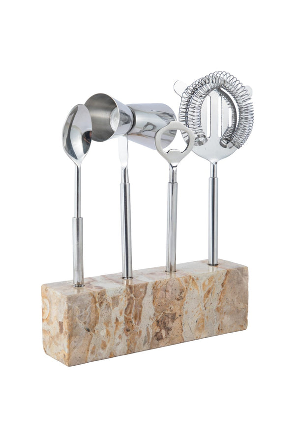 A sleek bartool set featuring four stainless steel bar tools and a jigger is neatly arranged in a rectangular stone holder, all standing upright against a white background—the perfect addition to any home bar.