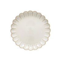 A round, off-white ceramic plate with scalloped edges and a slightly textured surface from the Marrakesh Dinnerware White collection by Casafina/Costa Nova, inspired by Moroccan tableware and viewed from above on a white background.