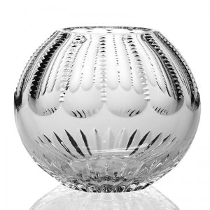 The Karen Rose Bowl 6″ by William Yeoward is a round, clear crystal glass bowl adorned with decorative vertical ridges and etched patterns that beautifully reflect light. Its surface features raised bumps and intricate cuts, creating an elegant, textured appearance in this handmade crystal piece.