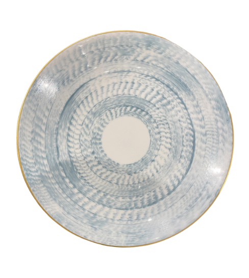 The Marie Daage Agate Dinnerware round ceramic plate features a white base, textured blue circular pattern, slightly raised edge, and thin gold rim. This luxury piece by Marie Daâge boasts a hand-painted, artisanal look.