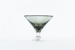 The Tyler Barry Design Footed Martini Glass features a wide rim and short stem, crafted from hand-blown glassware, and is shown empty against a plain white background.