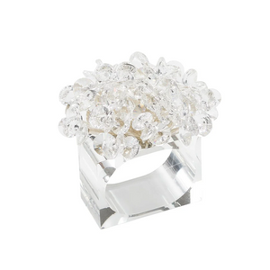 The Kim Seybert Aster Napkin Ring Set of 4 features clear, rectangular glass rings topped with transparent faceted bead clusters, adding a sparkling floral accent to your table décor.