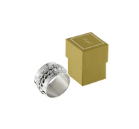 Christofle Babylone Silver Plated Napkin Ring in silver-plated metal with a raised, pebbled texture on its exterior, shown beside its small, square box.