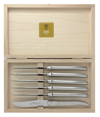 A set of six Claude Dozorme Inox Brillant Steak Knives displayed in an open wooden presentation box.