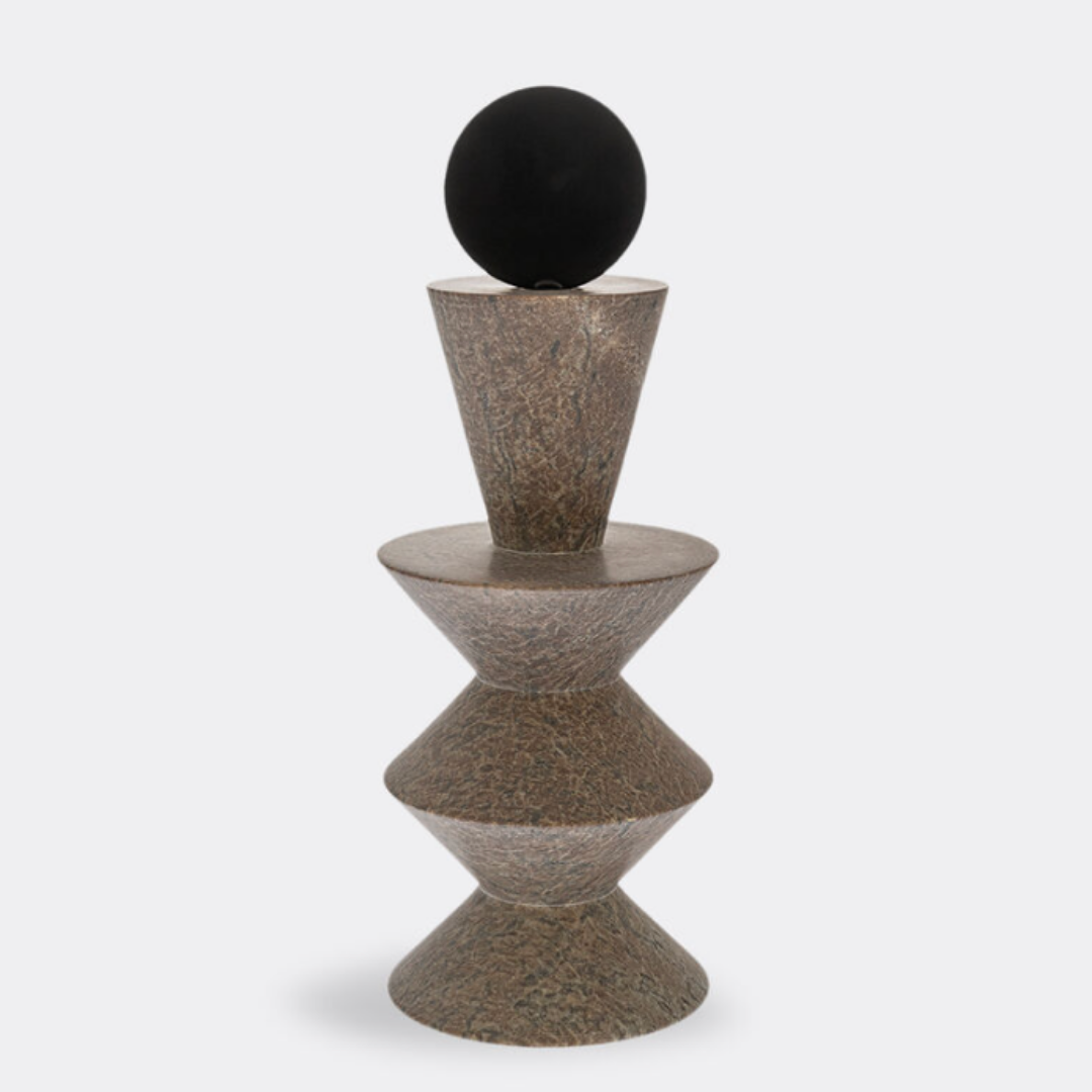 The Constantin Gray w/ Black Sculpture by Gardeco features two stacked conical forms separated by a disk, topped with a black sphere, evoking the look of a modernist totem in the style of Brâncusi and set against a plain white background.