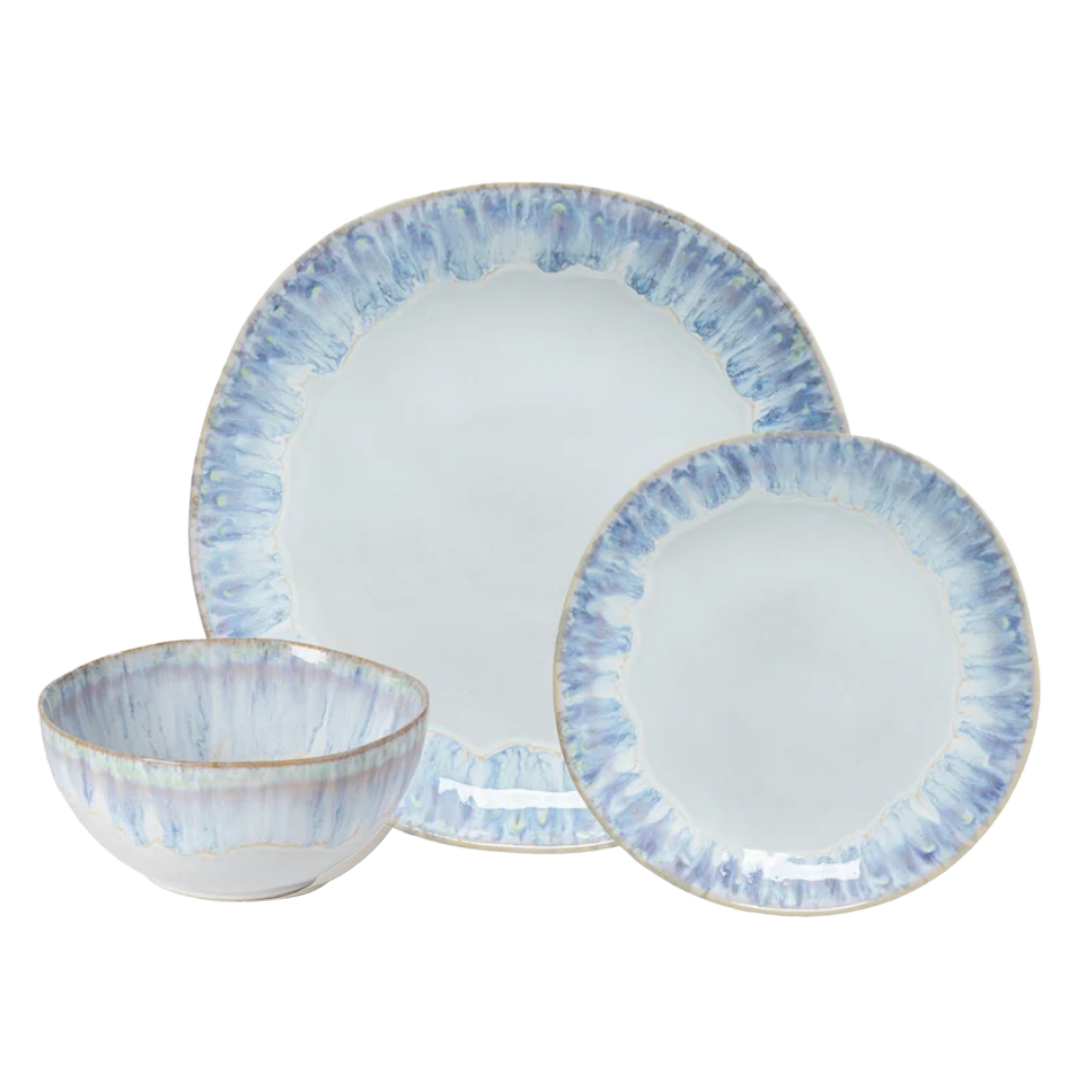 Experience the artistry of the Costa Nova Brisa Blue Dinnerware collection with this three-piece set—featuring a bowl, salad plate, and dinner plate. Each piece showcases a soft blue and white watercolor-inspired rim and an organic, irregular shape. Expertly crafted in Portugal, this set effortlessly blends everyday functionality with elegant design.