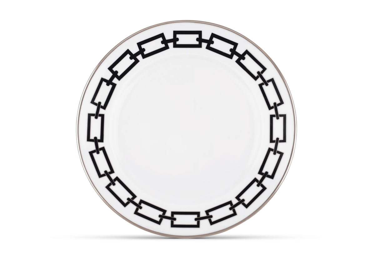 The Ginori 1735 Catene Nero Dinnerware features white porcelain adorned with a striking black geometric chain-link border around the rim, set against a pristine white background.