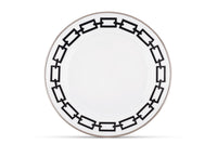 The Ginori 1735 Catene Nero Dinnerware features white porcelain adorned with a striking black geometric chain-link border around the rim, set against a pristine white background.