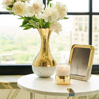 Dual Vase with Carrara marble in gold.
