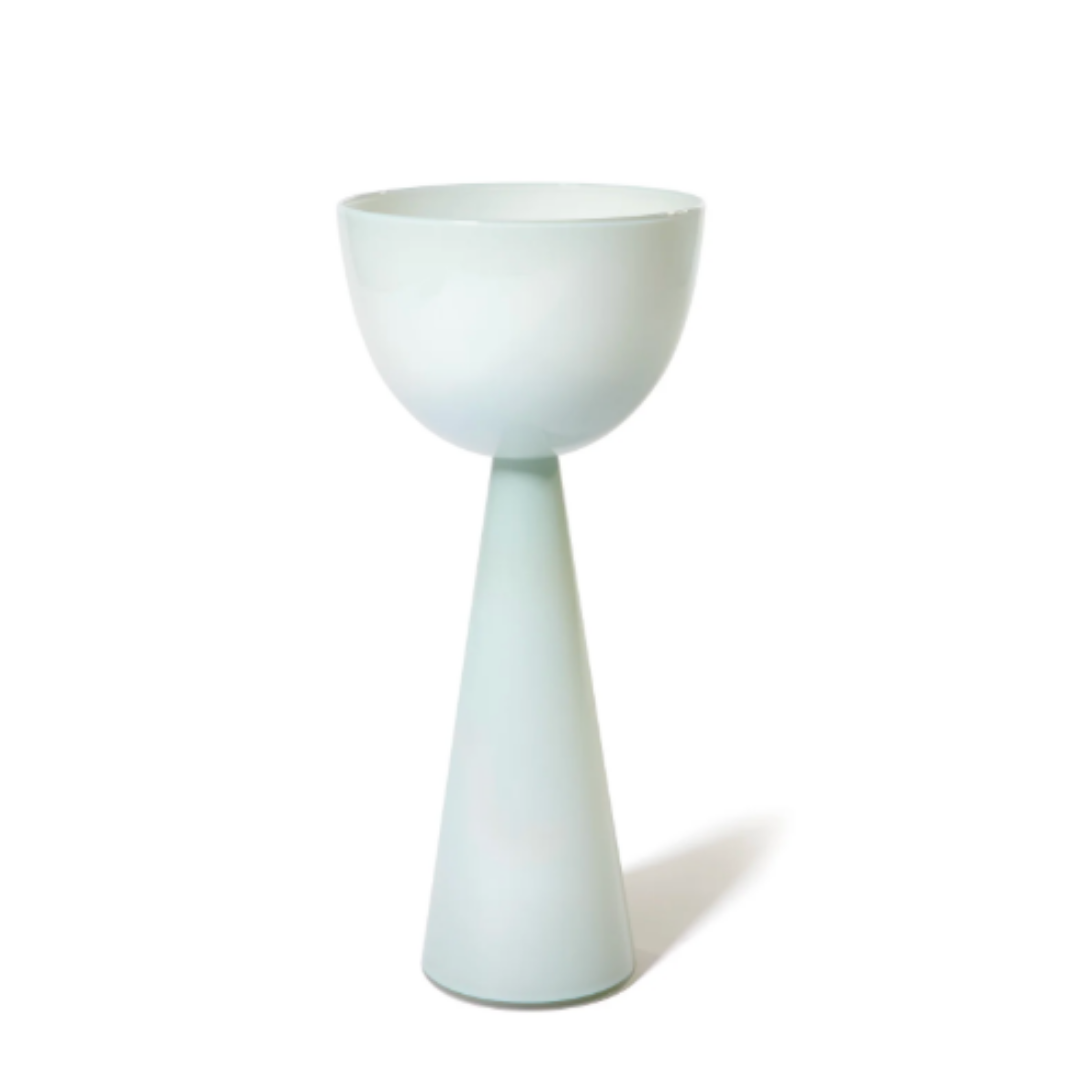 The Fiorelli Vases Ash by Current Home NY is a modern, minimalist vase with a glossy pale blue finish. Its wide bowl and tall conical base are ideal for sculptural floral displays, perfectly suited to contemporary spaces.
