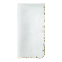 A set of four white Bodrum Firenze Napkins with gold embroidered scalloped edges, elegantly displayed on a plain white background.