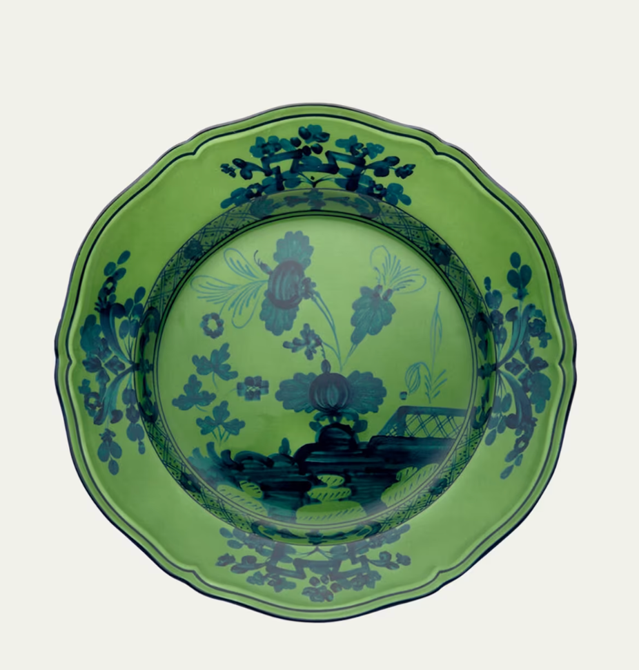 A green decorative plate with scalloped edges, displaying deep blue floral and leaf patterns along the rim and center—an exquisite piece from the Oriente Italiano Dinnerware Malachite collection by Ginori 1735, celebrated for its refined Italian craftsmanship.