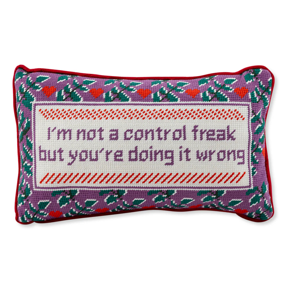 The Needlepoint Pillow - Control Freak by Furbish features a rectangular cotton velvet design with a purple, red, and green floral border. The white center reads "I’m not a control freak but you’re doing it wrong" in purple stitching.