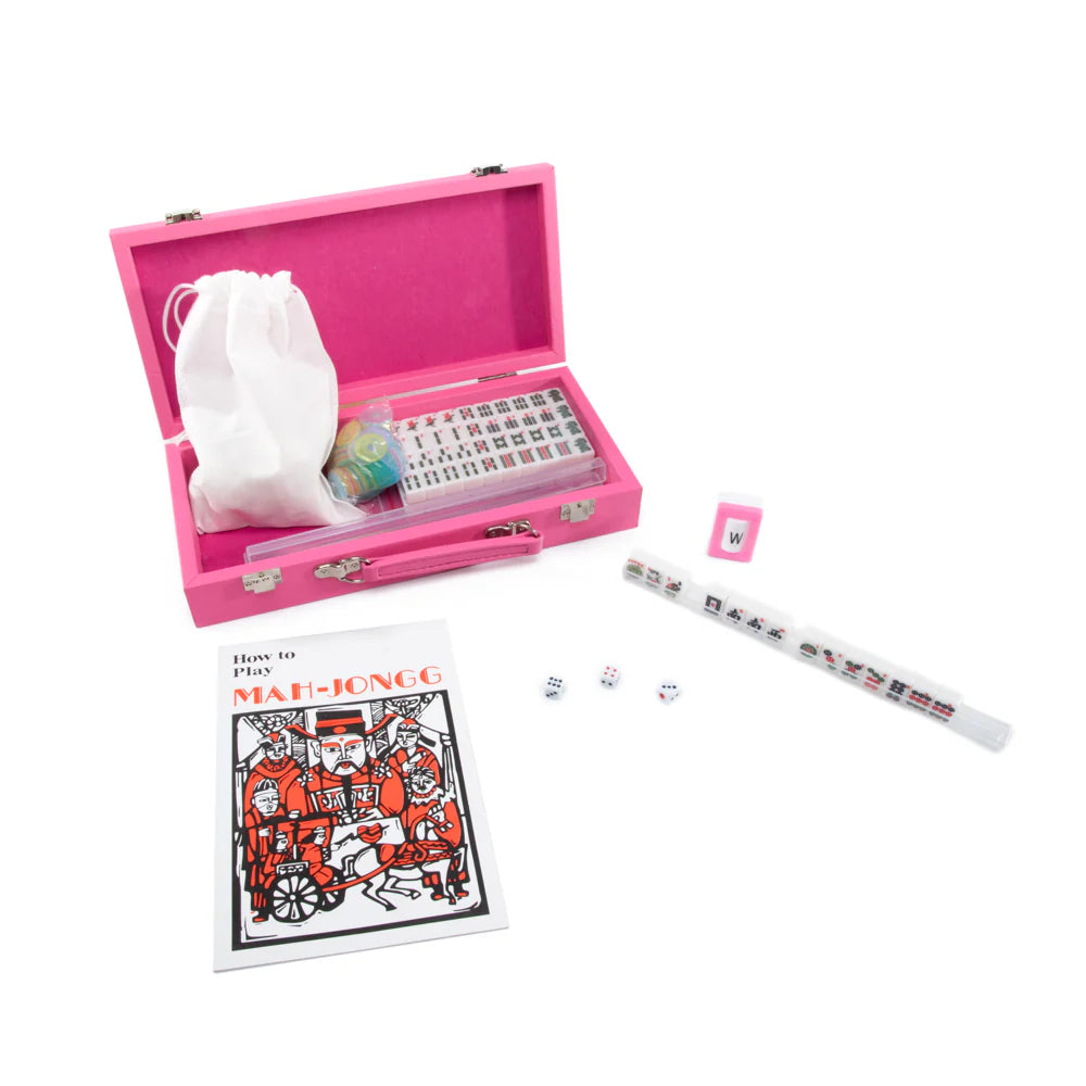 The Brouk & Co Mini Travel Mahjong Set, in pink, includes beginner-friendly tiles, dice, a W tile, and a How to Play Mah-Jongg booklet—perfect for new players or anyone wanting a portable mahjong set.