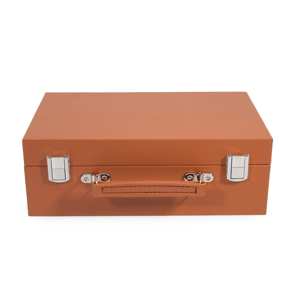 The Brouk & Co Mini Travel Rumi Set is a closed, rectangular orange-brown leather case with a handle and silver latches, shown against a white background.