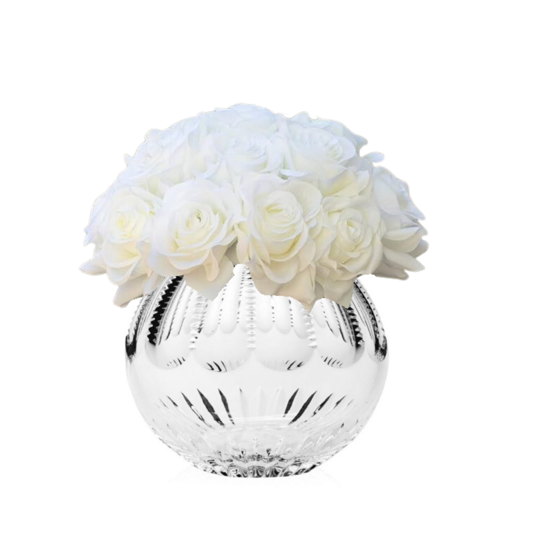 A clear, round Karen Rose Bowl 6″ by William Yeoward holds a bouquet of white roses with soft petals, arranged closely together against a plain white background.