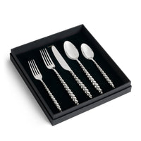 Jessica McCormack Shell Flatware 5 pc Set - Stainless Steel featuring textured, beaded-style handles, presented in a black display box as a luxury designer tableware collection.