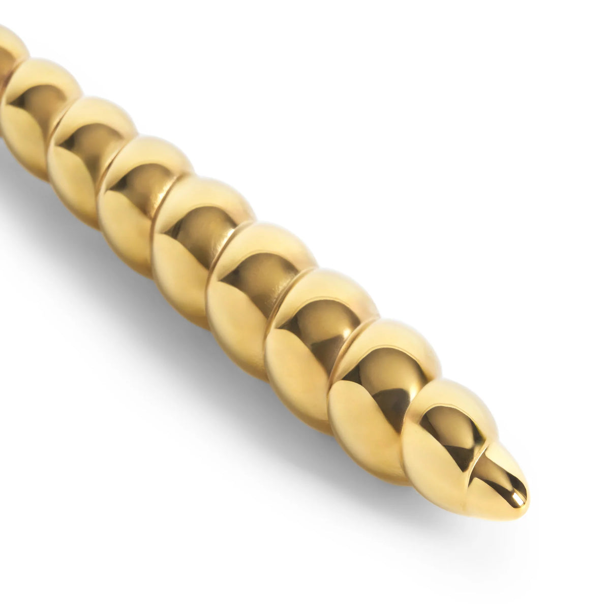Gold-toned handle from the L’Objet Jessica McCormack Shell Flatware 5 pc Set, featuring a textured, segmented design resembling a shell or spiraled beads.
