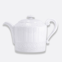 The Bernardaud Louvre Dinnerware collection features a white ceramic teapot adorned with a decorative pattern inspired by Renaissance motifs, complete with a curved handle, short spout, and a lid topped with a small knob—all set against a plain light background—making it an ideal choice for adding elegance to any white table setting.