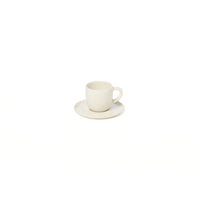A small, plain white Maguelone Dinnerware Quartz cup by Jars - Rosenthal sits on a matching saucer against a white background, evoking the timeless style of classic Mediterranean dinnerware.