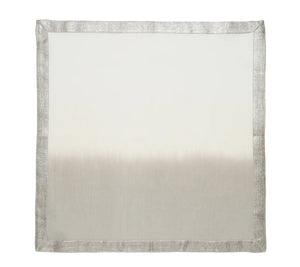The Kim Seybert Dip Dye Napkins - Earthtones (Set of 4) feature a square linen design with a subtle gradient from light cream to light gray, accented by an elegant metallic foil border for added shimmer.